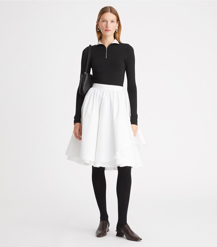 Tory Burch designer tops Zip Front Long-Sleeve Jersey Top in Black on model front