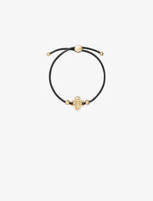 Shop Tory Burch Kira Clover Slider Bracelet In Tory Gold/chocolate Brown